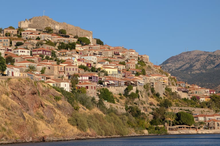 view of Molyvos Castle from across  the Aegean Sea in Mithymna, Greece