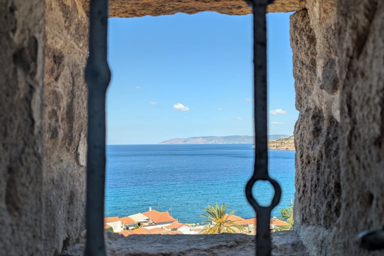 View from a window of the Aegean Sea from the Holy Church of the Virgin Mary Glykophilousa in Petra 