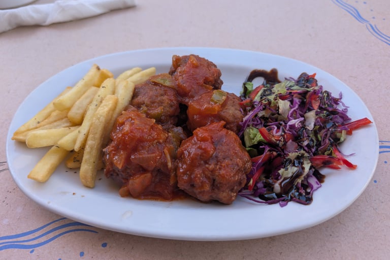 greek meatballs with french frys and salad from Cafe Tavern Costas in Petra, Greece