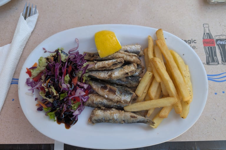 fried sardines with french frys and asaladfrom Cafe Tavern Costas in Petra, Greec