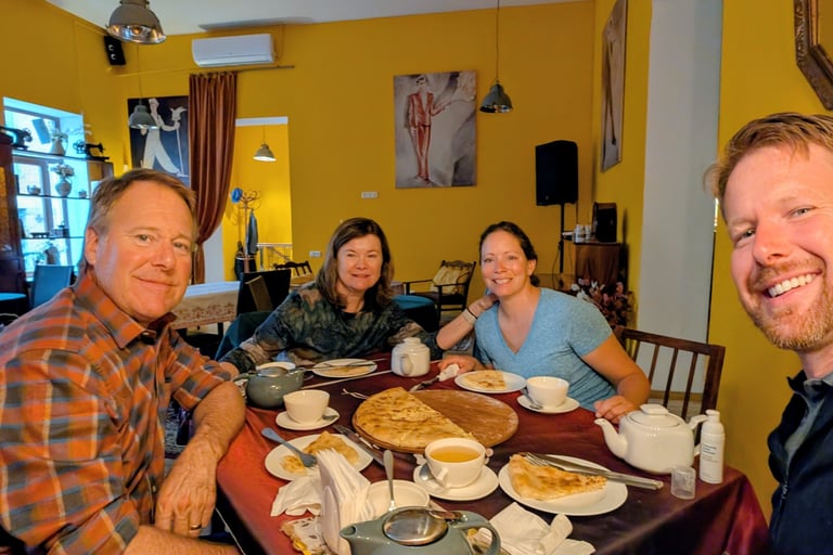 family enjoying tea and khachapuri at Tea House Foe-Foe in Kutaisi Georgia