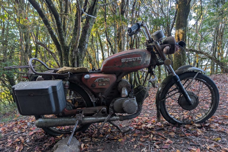 a famous abandoned Suzuki motorcycle on forest rd 730 in Taiwan