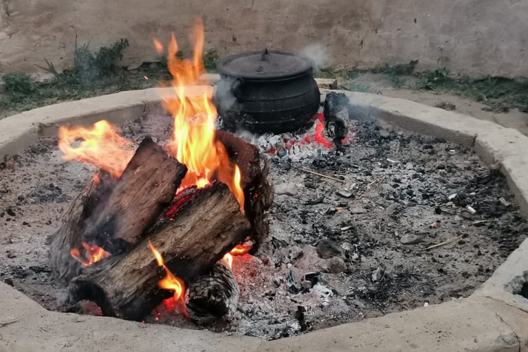Hiking Shack Firepit with black pot cooking