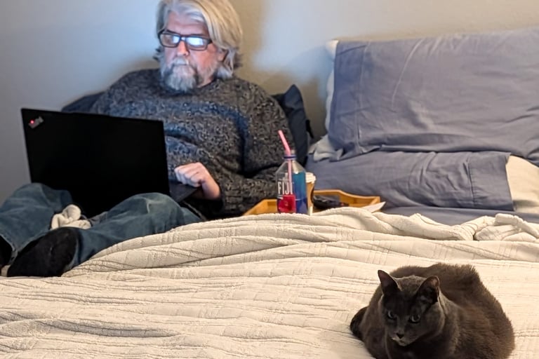 Greg Rowland with his cat Big Bit
