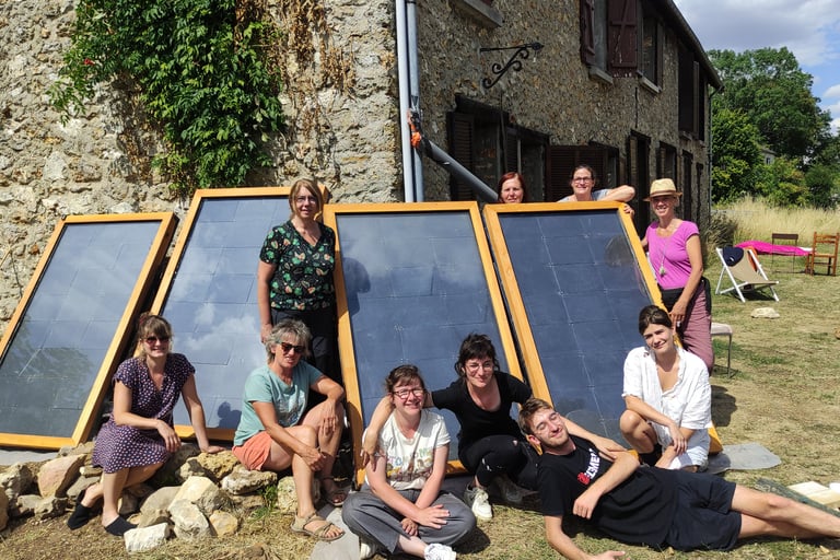 a group of people standing around a solar paneled window