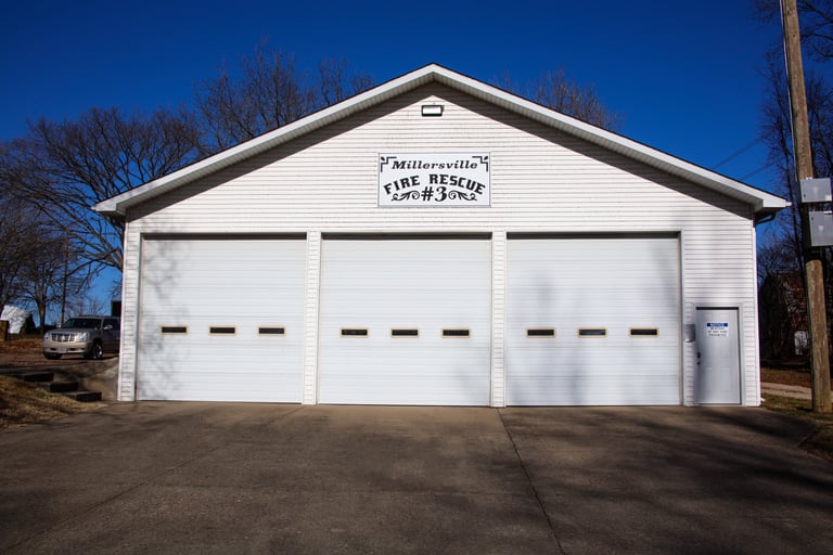 A fire station with 3 garage doors