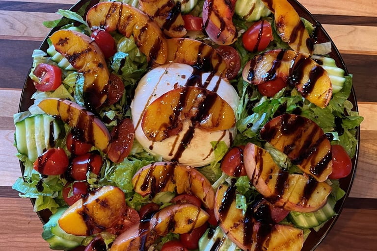a salad with grilled peaches and burrata