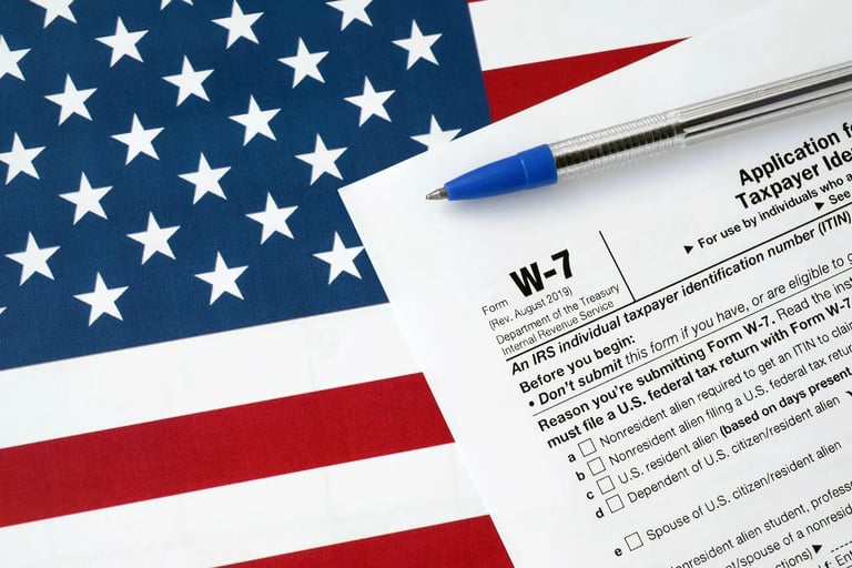 a pen. W-7. Itin number. Taxes. Accounting. ITIN Number in USA