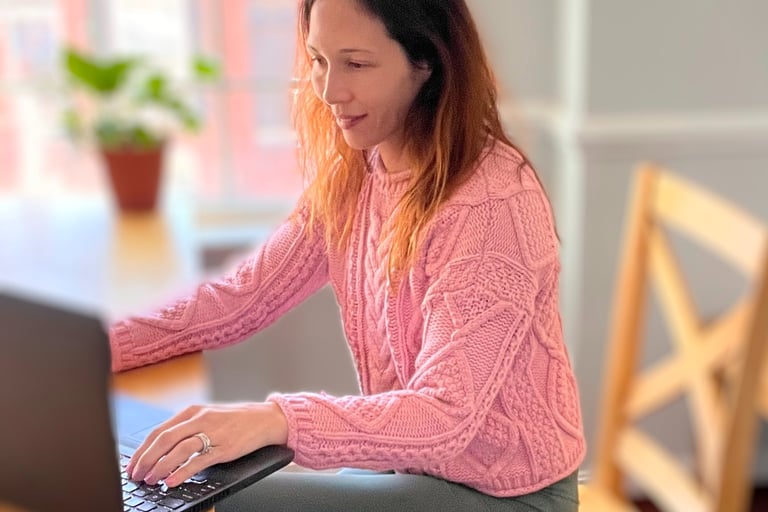 Dr. Nicole Rowe working at computer