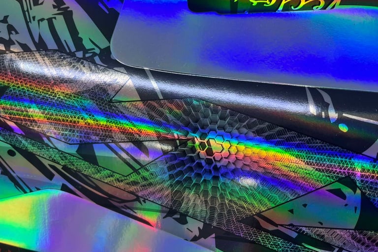 a close up of a colorfully colored skateboard