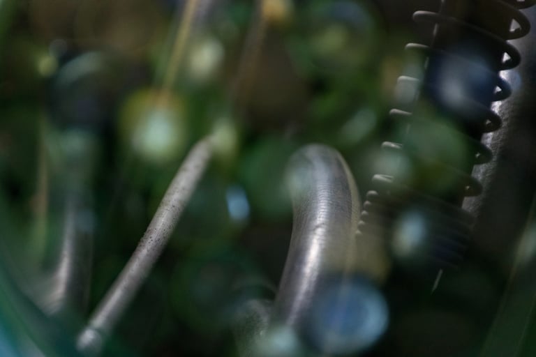 Glass pebbles with a water house in the reflection.