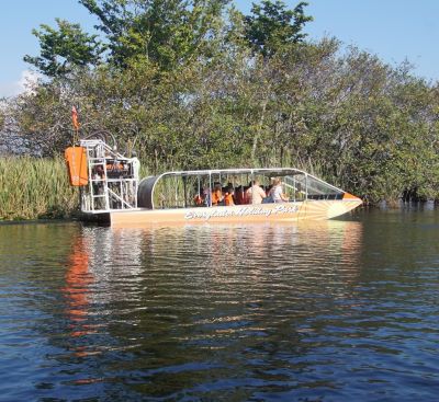 a boat with people in a boat on the water