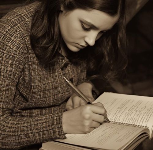 A young woman writing with a fountain pen in a notebook, captured in a sepia-toned vintage style.