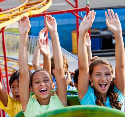a group of children's hands up in the air