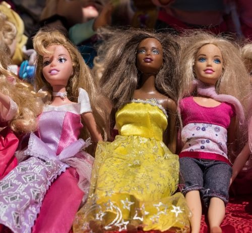 a group of dolls sitting on a table