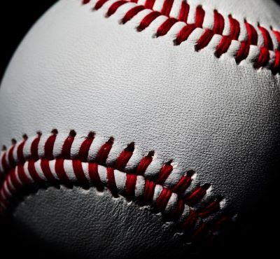 a baseball ball with red stitching on it