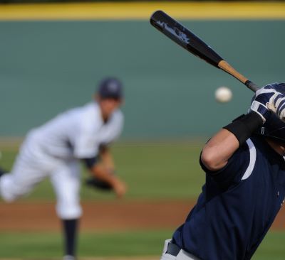 a baseball player is swinging a bat at a baseball game