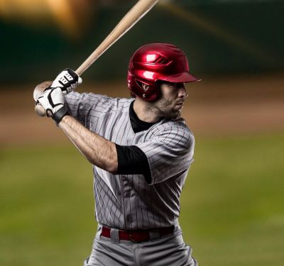 a baseball player is holding a bat and a bat