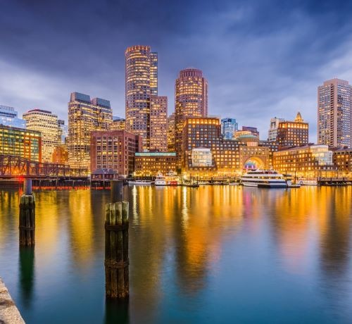 boston city skyline with a river and a bridge