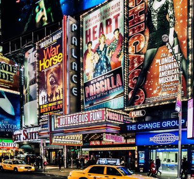 New York - a taxi cab cab driving down a busy street
