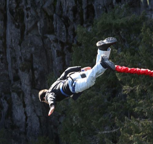 a person is doing a trick on a rope - line