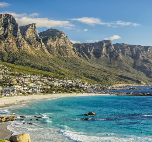 a beach with a mountain in the background
