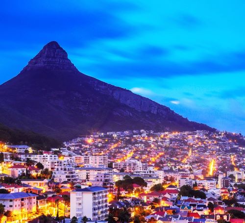 a cityscape of a mountain with a mountain in the background