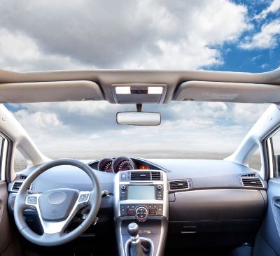 a car dashboard with a steering wheel and dashboard
