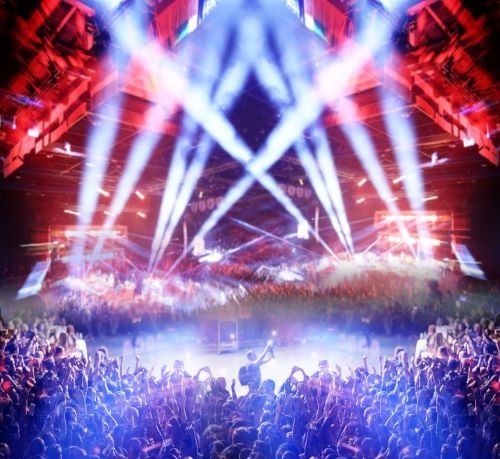 a concert stage with a large crowd of people