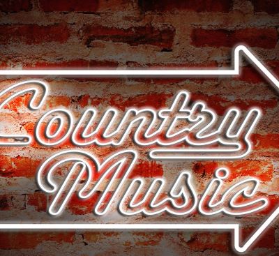 a country music logo with a arrow pointing up
