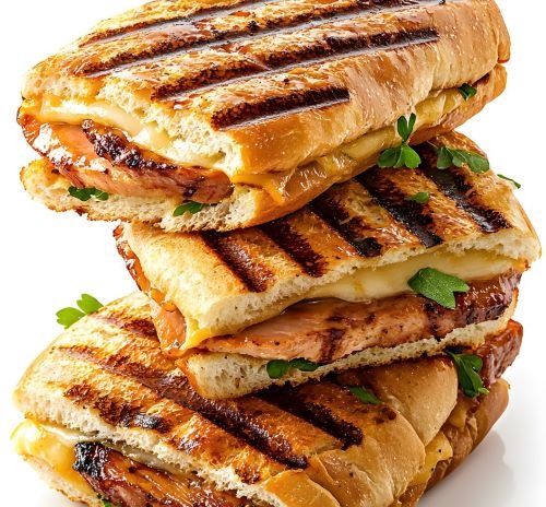 a stack of grilled sandwiches with grilled cheeses