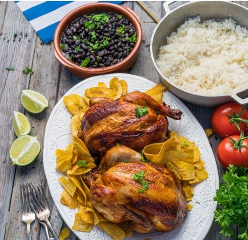 a plate of food with a bowl of rice, chicken and vegetables