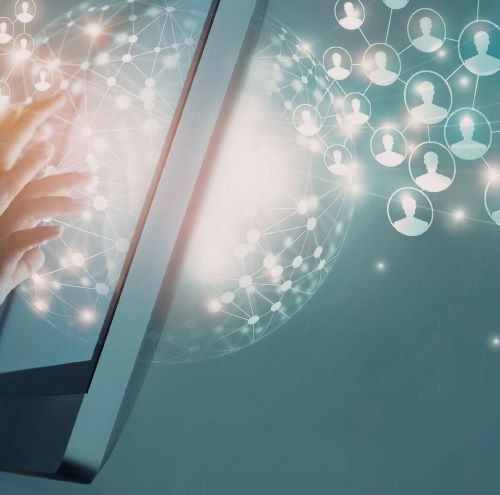 a person holding a laptop computer and touching a laptop