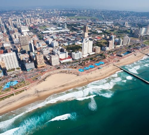 a city skyline view of a beach and Durban city