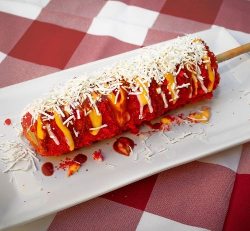 a long elotes - stemmed corned beef roll with cheese and cheese
