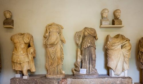 a group of statues of statues of women and men