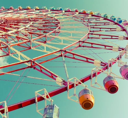a ferris wheel with a ferris wheel in the sky