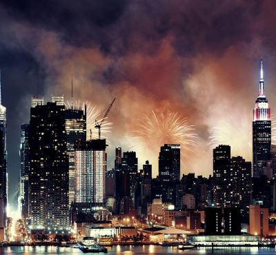 nyc fireworks in the sky over a city skyline
