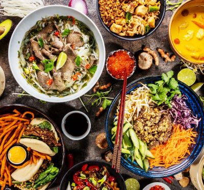a variety of asian food dishes on a table