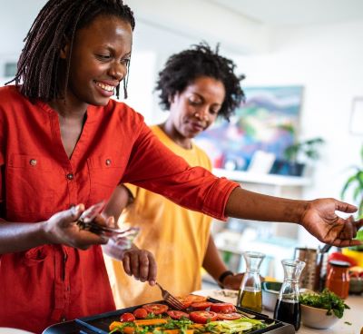 a woman is preparing a meal in a kitchen