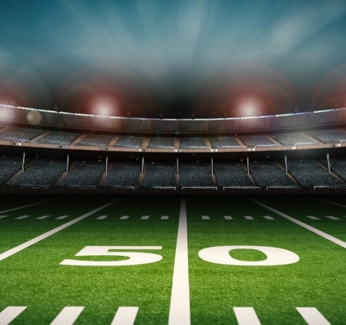 a football field with a stadium stadium full of people