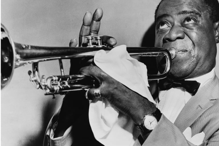 a man in a suit and bow tie playing the trumpet