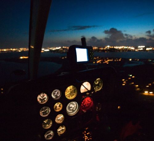 a view of a plane in the night sky