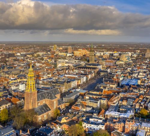 a cityscape of a city with a clock tower