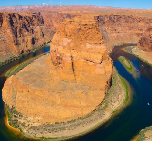 a river running through a canyon in the desert