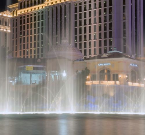 a fountain of water in front of a luxury hotel in Las Vegas