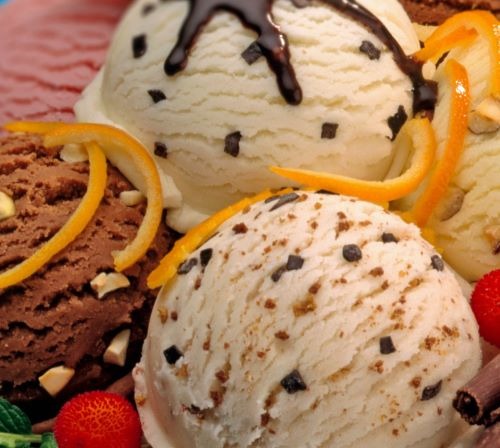 a plate of ice cream with chocolate chips and chocolate chips