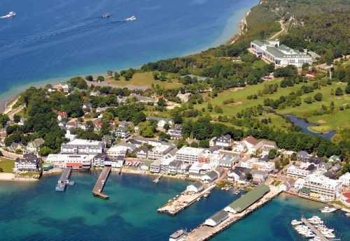 a large body of water with a boat in the background