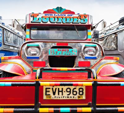 a truck with a colorful painted truck on it