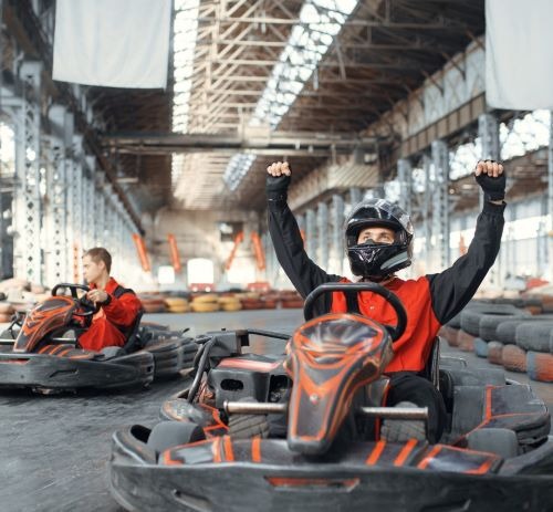 a man in a helmet and go kart
